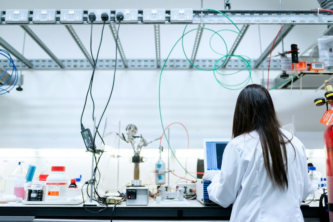 Chemical engineer working on a laptop in a laboratory