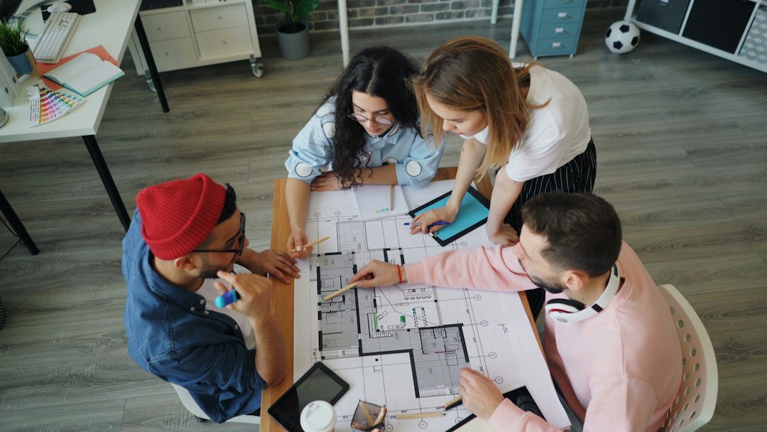 A team working together around a table on a project